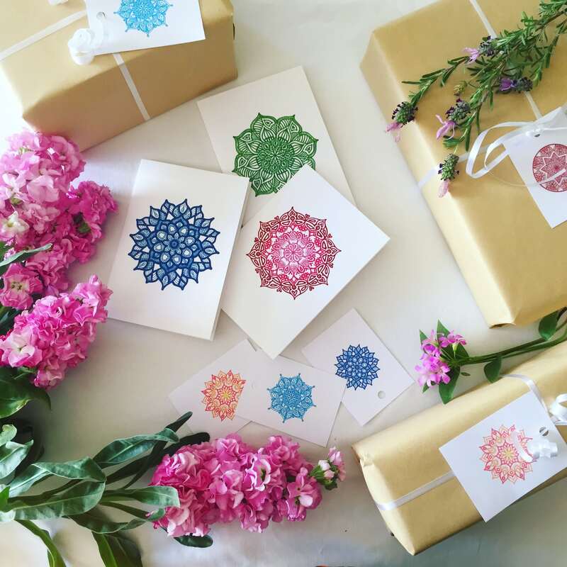Artistic greeting cards paired with bunches of fresh flowers