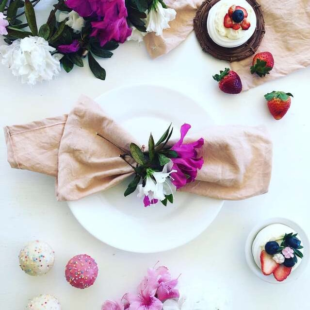 Luxury napkin rings paired with pink cupcakes and white flowers