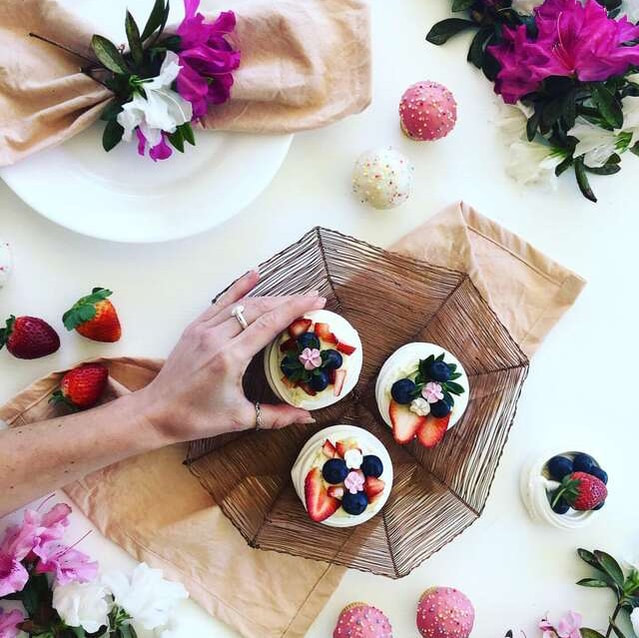 Unique napkin rings paired with berries, fresh cream and meringues with pink napkins