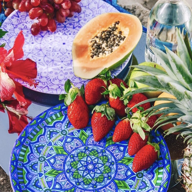 Coastal inspired homewares and tableware filled with a tropical fruit platter