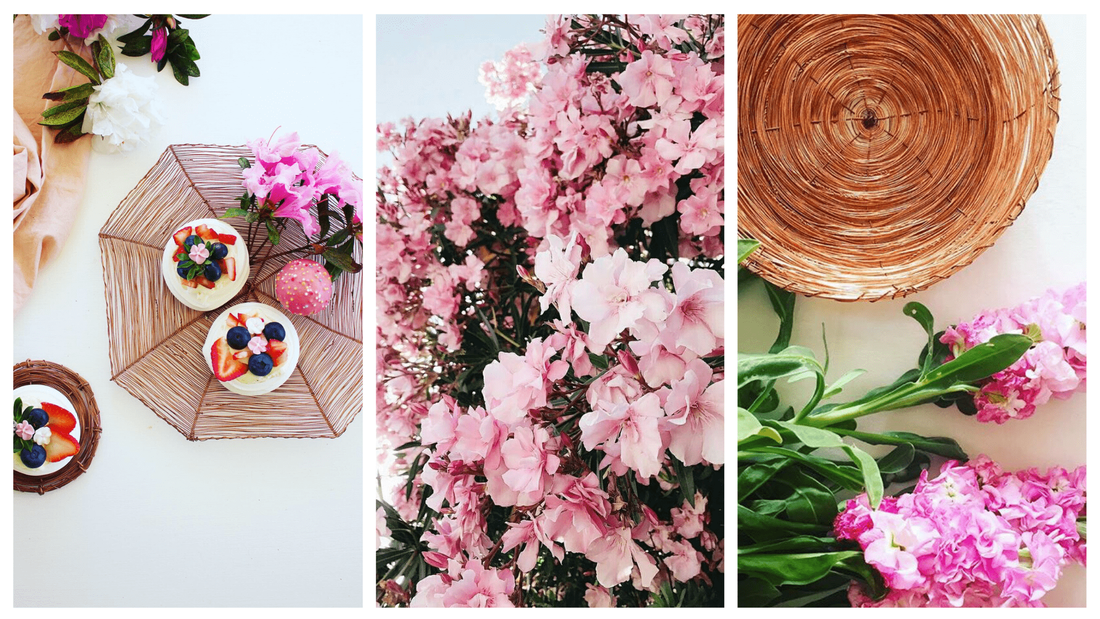 Beautiful and bespoke copper creations surrounded by pink flowers and pretty greenery