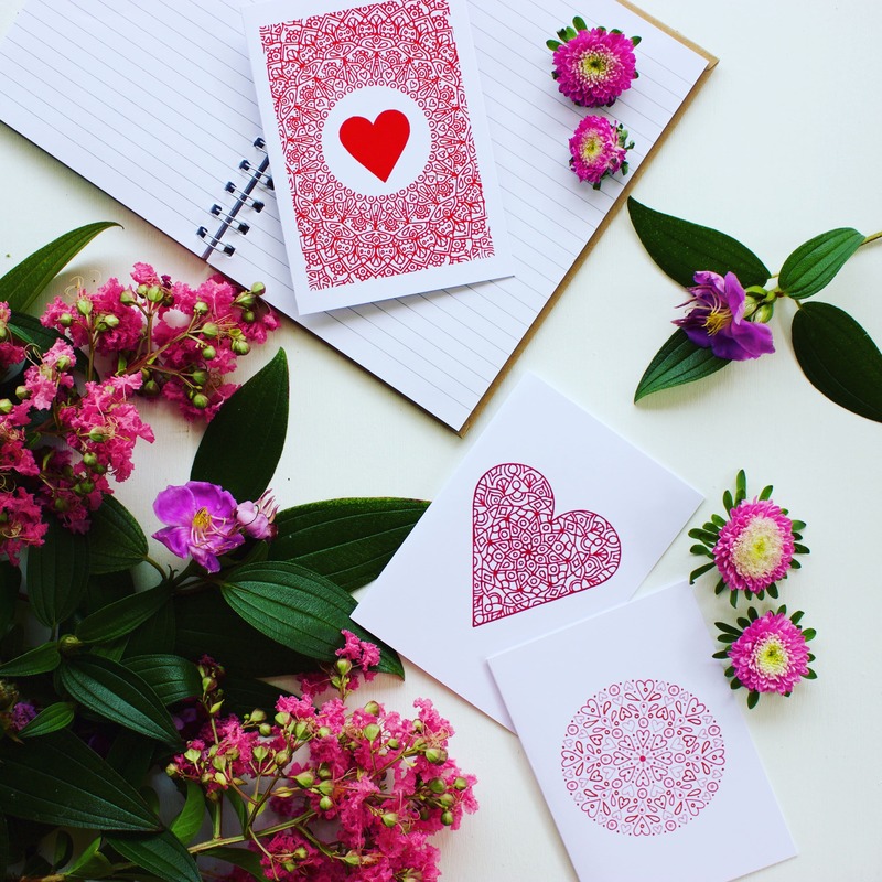 Love inspired gift cards styled with fresh flowers and pretty greenery
